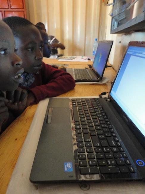 Students at Ngeya School seeing their first computers.